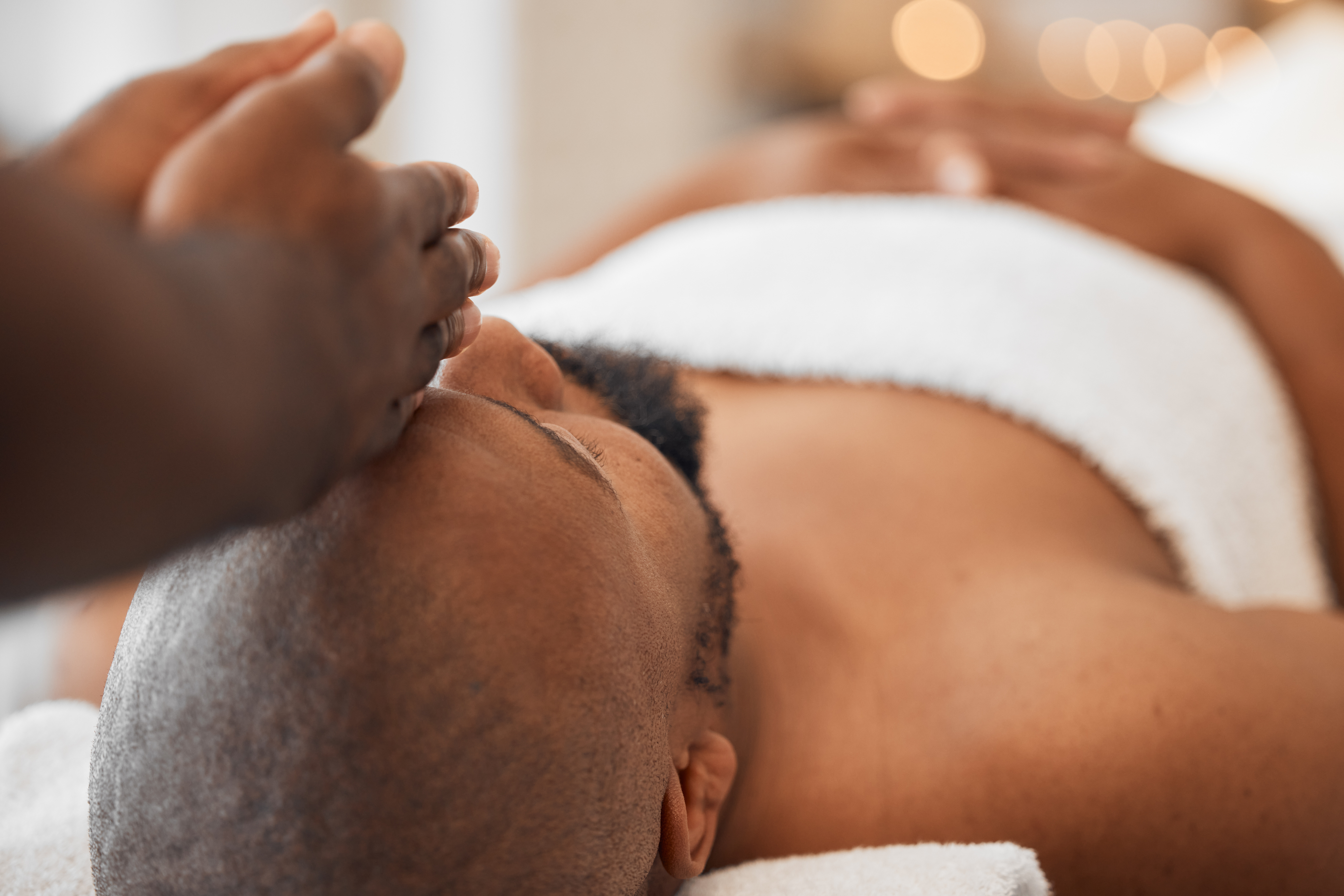 spa-african-man-and-masseuse-hands-for-head-massa-2023-11-27-05-36-25-utc